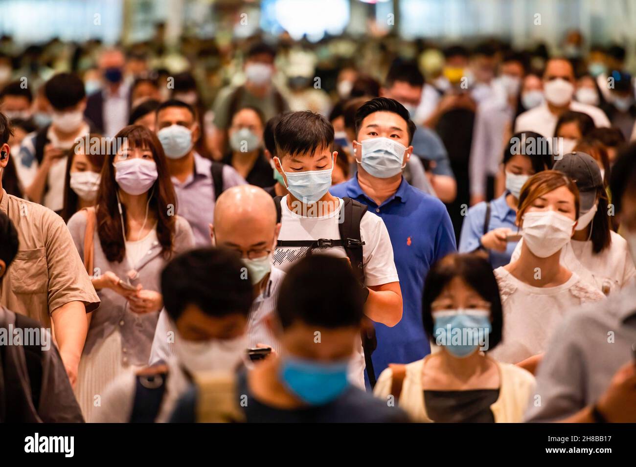 Hong Kong, China. 6th Oct, 2021. A large crowd of people is seen wearing face masks as they commute at the Central MTR subway station.The city of Hong Kong is on high alert as a heavily-mutated new Covid-19 variant known as the Omicron variant has been detected from a passenger traveling from South Africa. (Credit Image: © Budrul Chukrut/SOPA Images via ZUMA Press Wire) Stock Photo