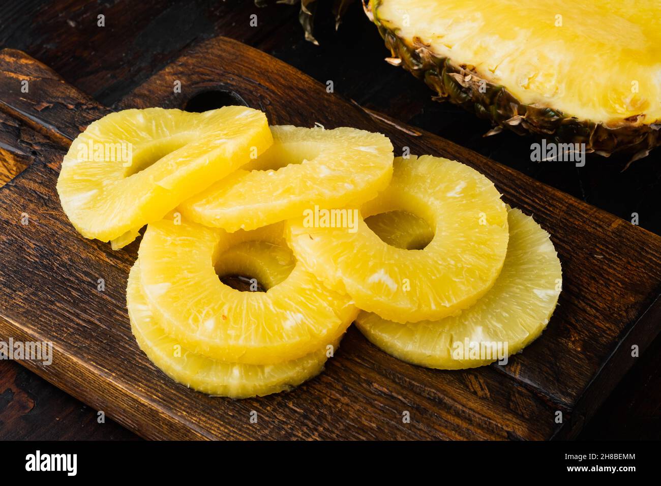 Sliced pineapple set, on old dark wooden table background Stock Photo