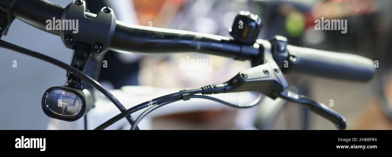 Bicycle handlebars with handbrake and flashlight closeup Stock Photo