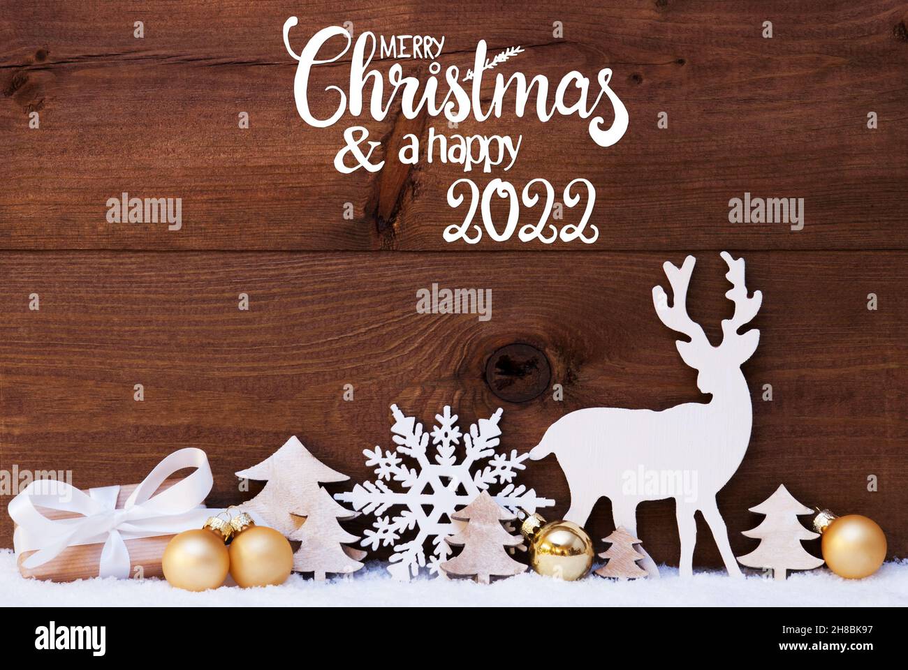 Reindeer, Gift, Tree, Golden Ball, Snow, Merry Christmas And A Happy 2022 Stock Photo