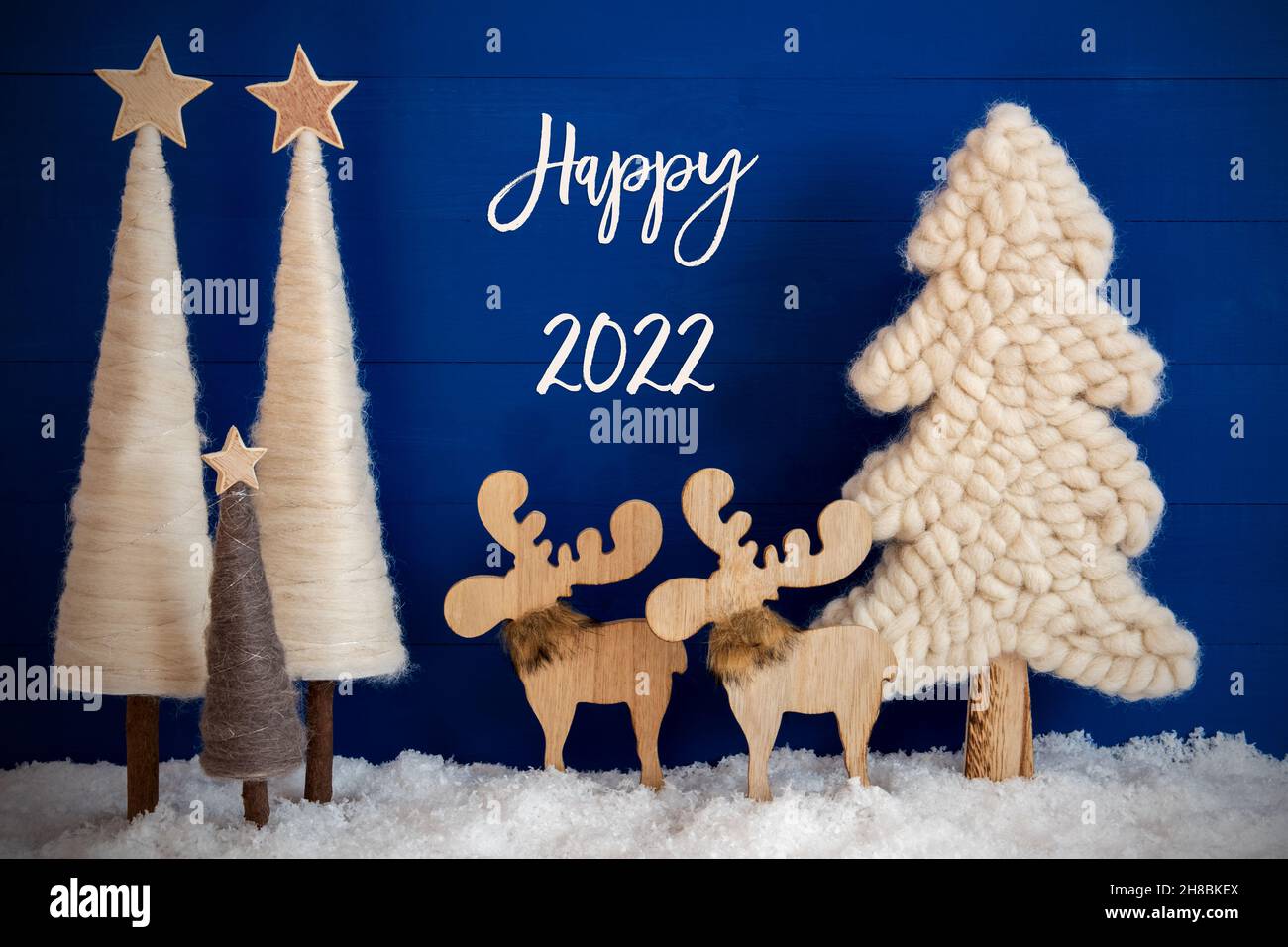 Christmas Tree, Moose, Snow, Text Happy 2022, Blue Background Stock Photo