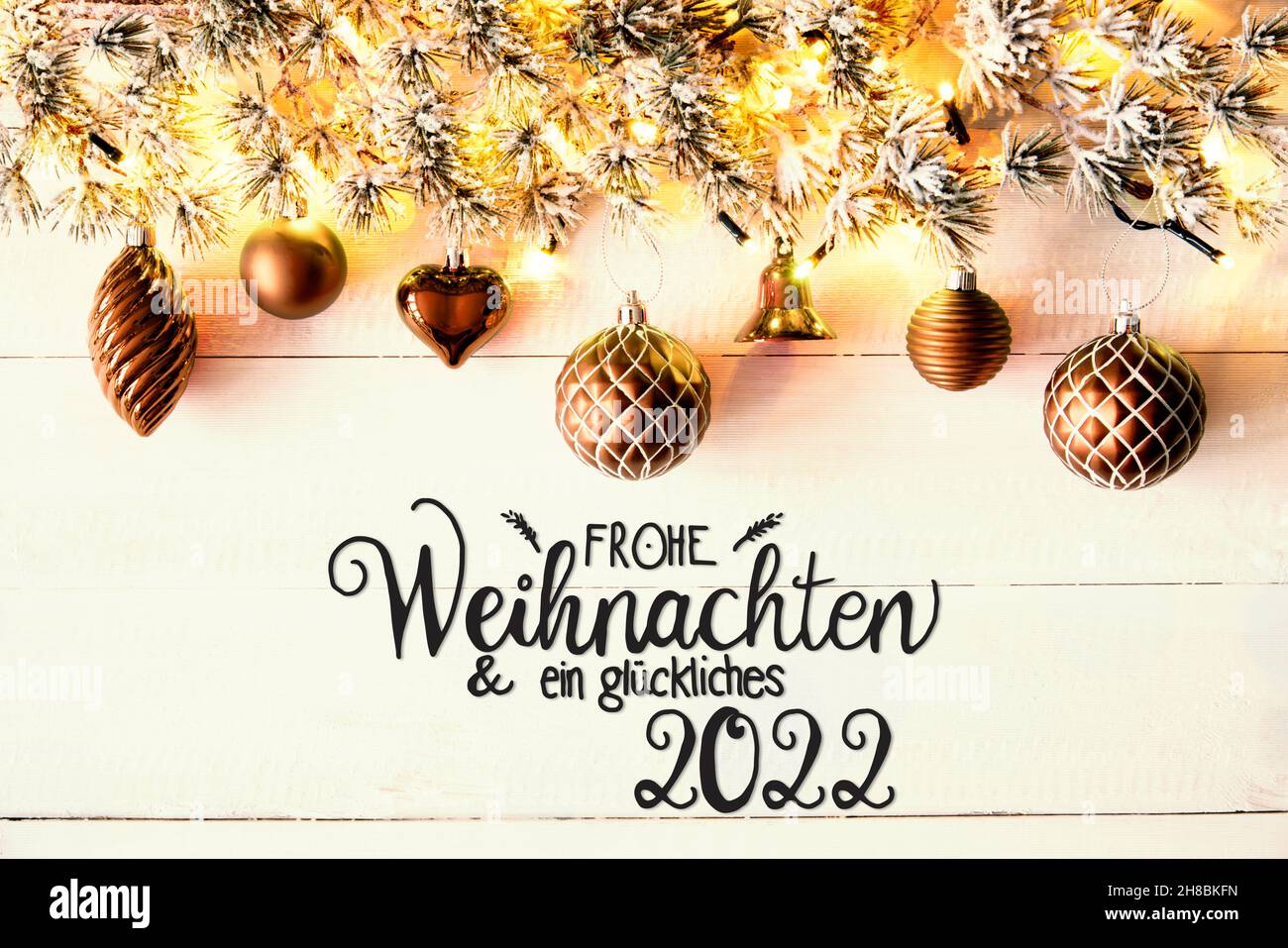 Golden Christmas Decoration, Fir Branch, Glueckliches 2022 Means Happy 2022 Stock Photo