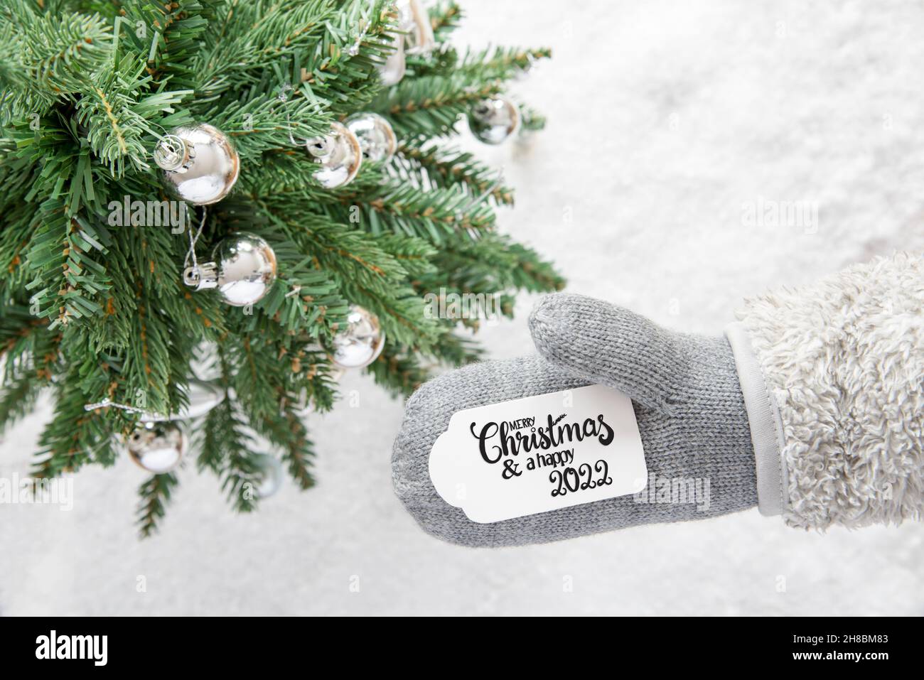 Gray Glove, Tree, Silver Ball, Merry Christmas And Happy 2022 Stock Photo