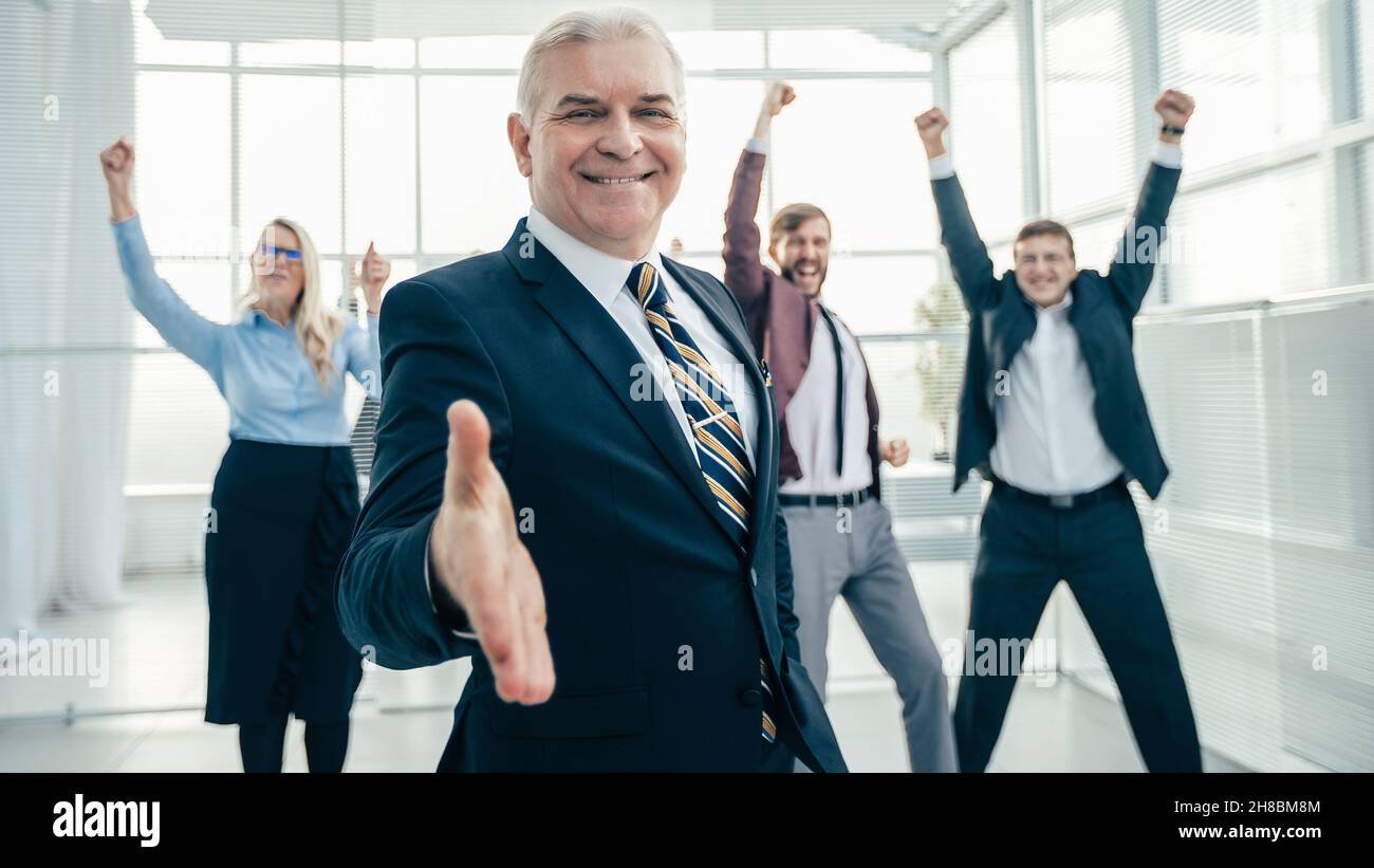 confident businessman holding out his hand for a handshake Stock Photo ...
