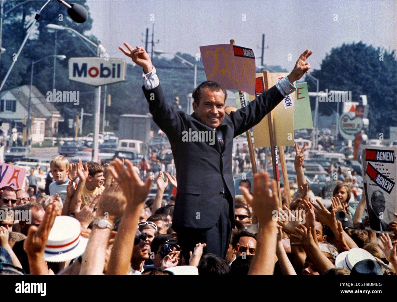 PAOLI, PA, USA - July 1968 - Richard Nixon gives his trademark victory sign while in Paoli, PA (Western Philadelphia Suburbs/Main Line) during his suc Stock Photo