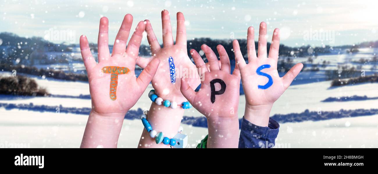 Children Hands Building Word Tips, Snowy Winter Background Stock Photo