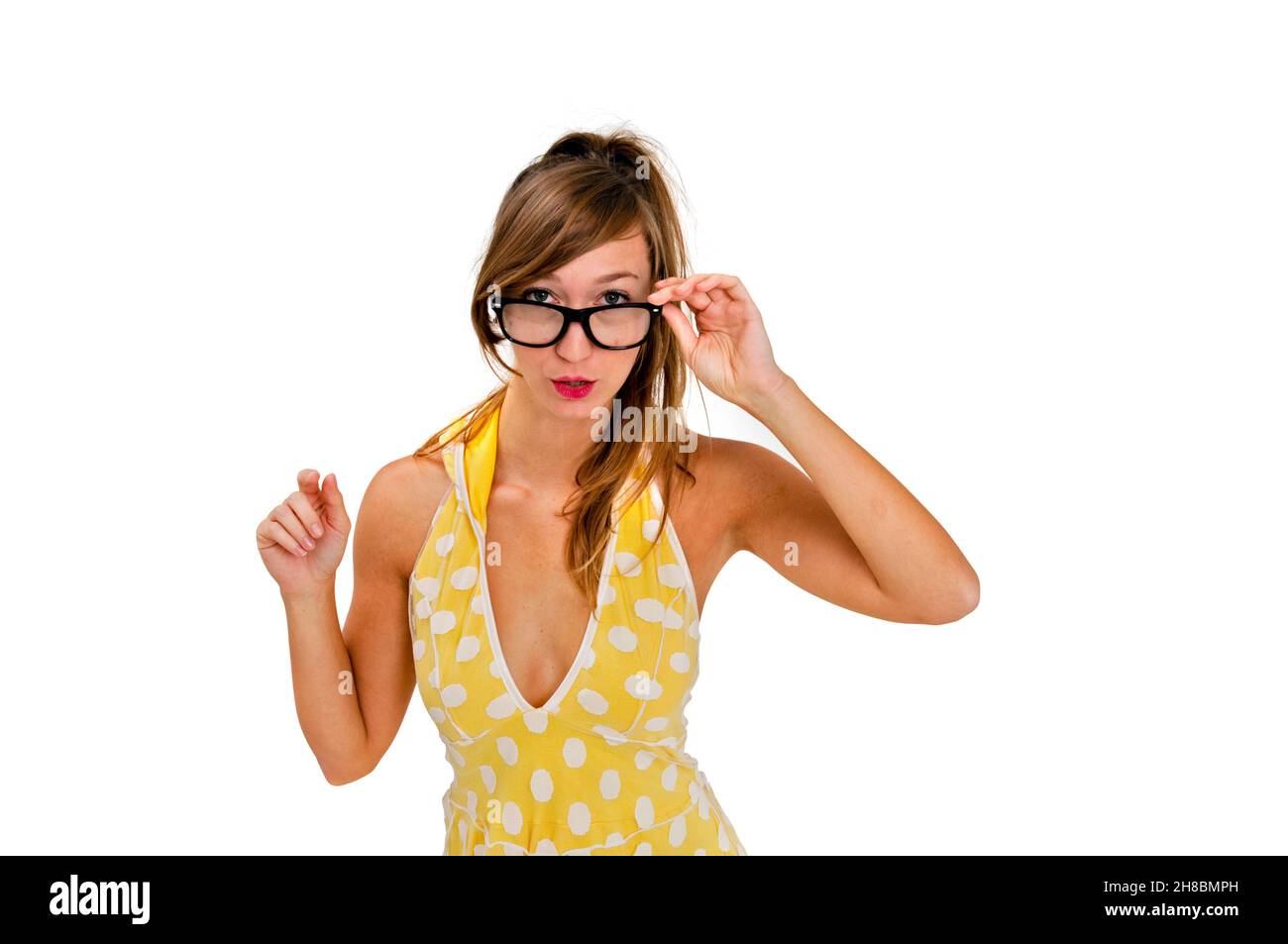 Intelligent looking young woman with reading gasses Stock Photo