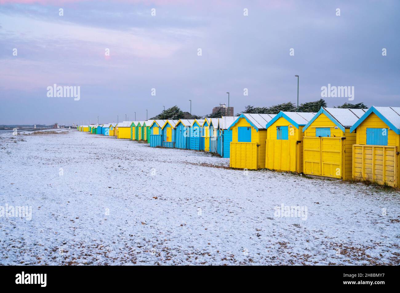 Littlehampton, West Sussex, UK. Monday 29th November 2021. The beach at Littlehampton with remaining snow after last night's snowfall, on a freezing cold morning on the South Coast. Credit: Geoff Smith/Alamy Live News Stock Photo