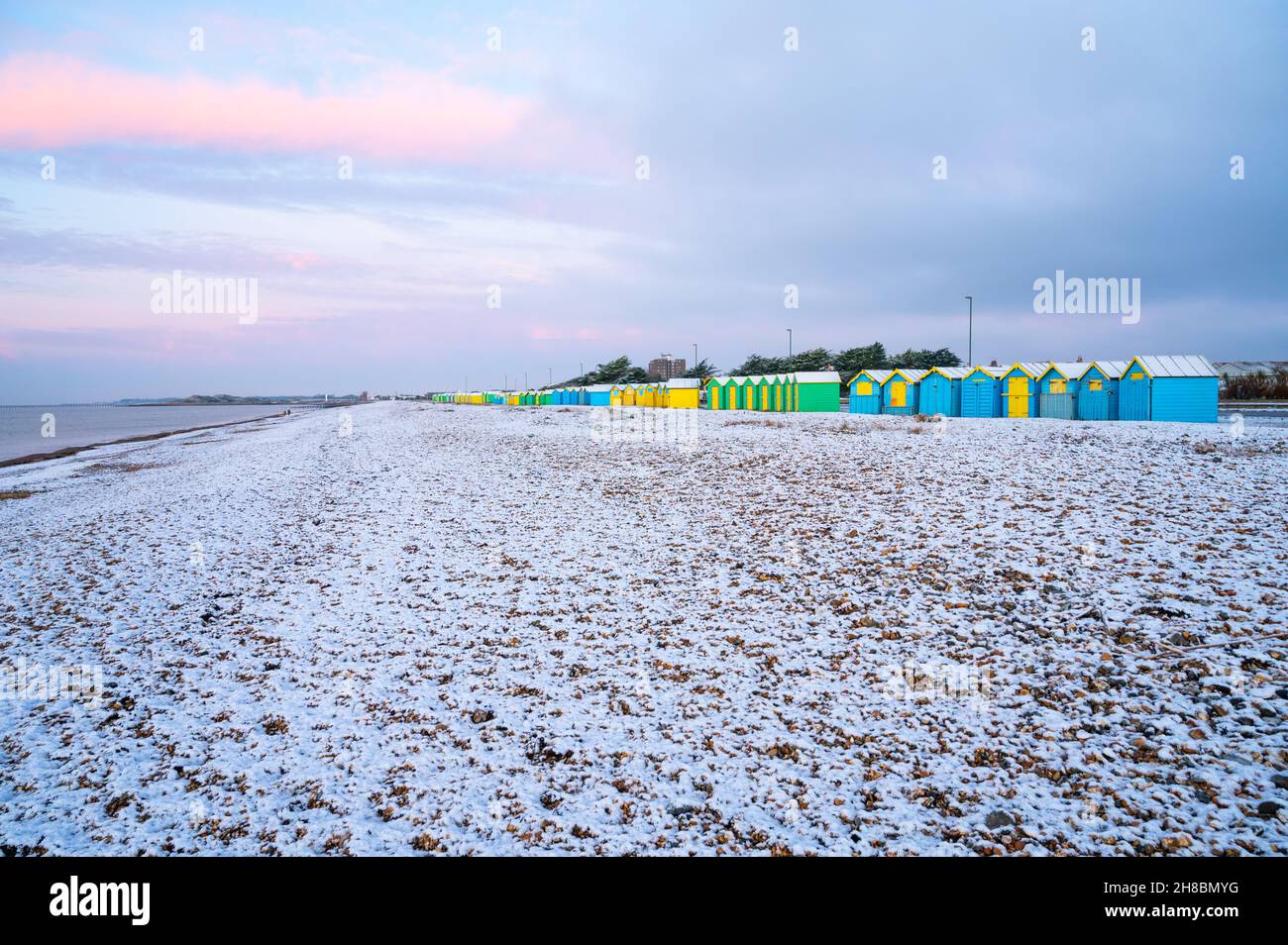 Littlehampton, West Sussex, UK. Monday 29th November 2021. The beach at Littlehampton with remaining snow after last night's snowfall, on a freezing cold morning on the South Coast. Credit: Geoff Smith/Alamy Live News Stock Photo