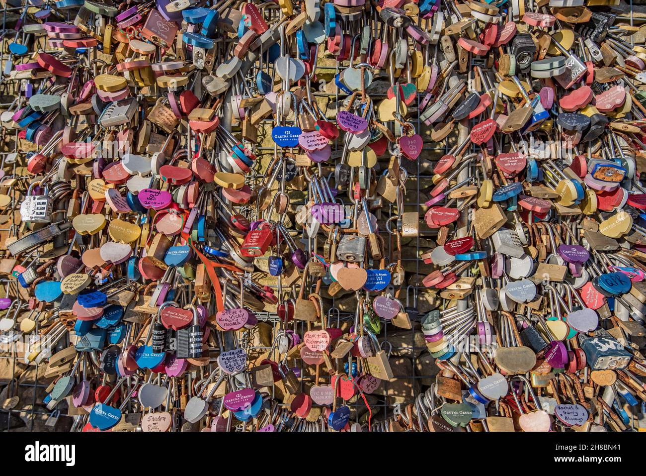 Lovelocks on 'The Wall of Love' located at the rear of the Gretna Green Blacksmith's shop and services .............taken November 2021 Stock Photo