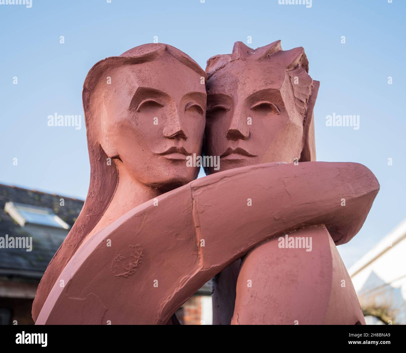 “The Lovers,” Kenneth Allen’s sculpture, of an embracing couple, in the small sculpture courtyard at Gretna Green (Scotland} nr the Blacksmith's shop Stock Photo