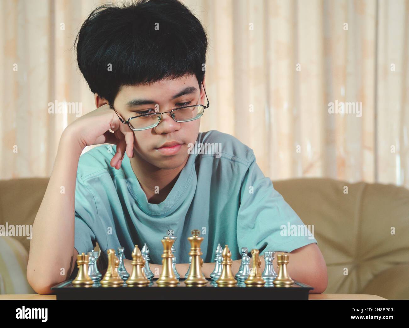 Concentrated serious boy developing chess gambit, strategy ,playing board  game to winner clever concentration and thinking child while playing chess.  Learning, tactics and analysis concept. 7292819 Stock Photo at Vecteezy