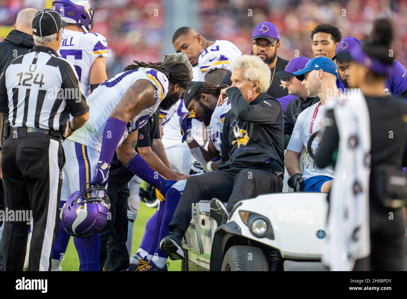 Minnesota Vikings teammates console Minnesota Vikings running back Dalvin Cook (33) as he is taken off the field due to an injury during the third qua Stock Photo