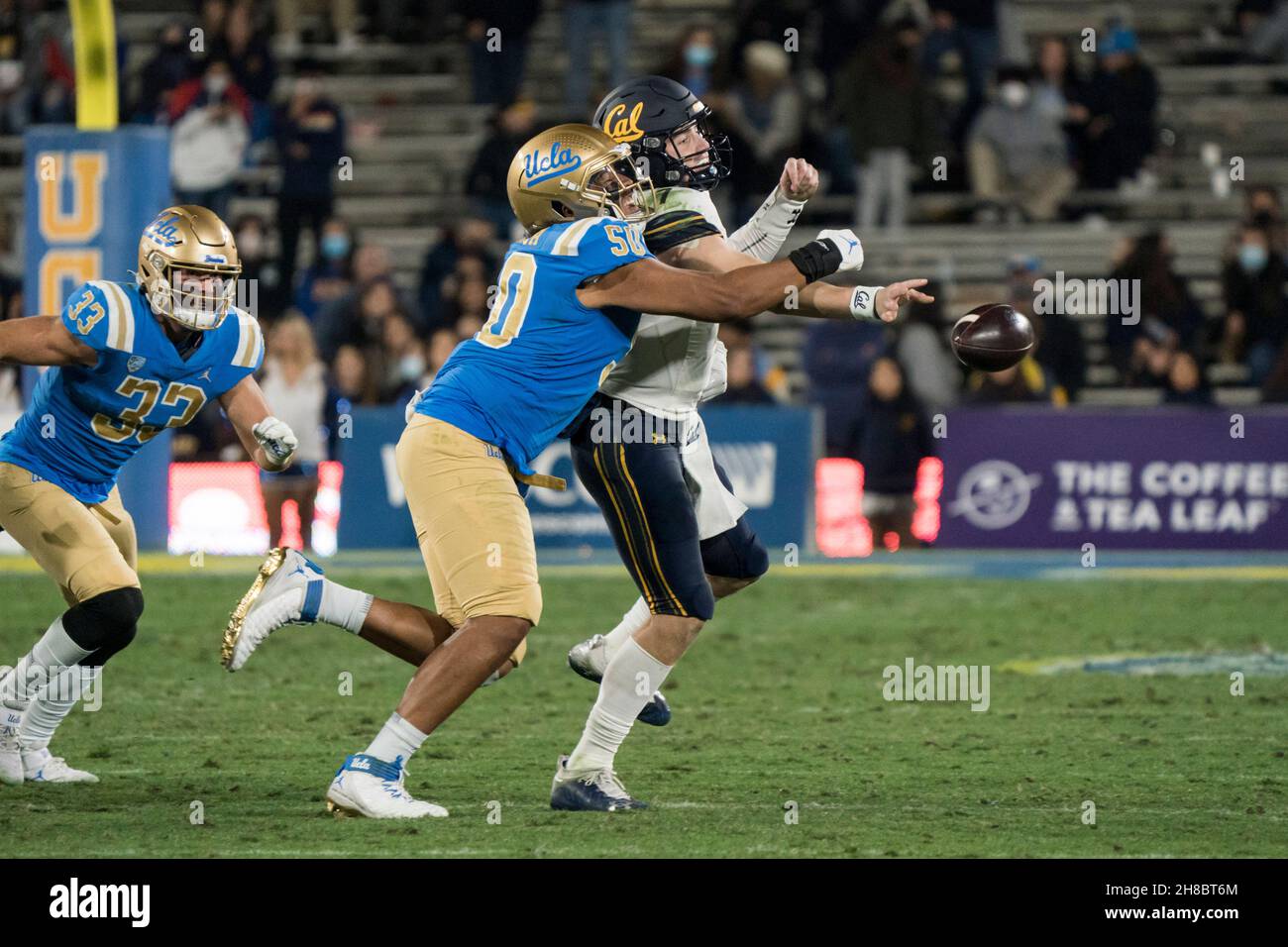 UCLA Bruins defensive lineman Tyler Manoa (50) wraps up California Golden Bears quarterback Chase Garbers (7) as he tries to toss a pass during a NCAA Stock Photo