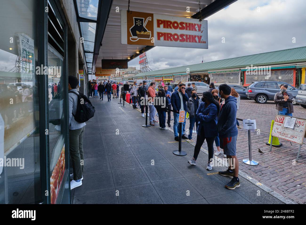 People Stand In Line In Famous Russian Piroshky Bakery near Seattle Pike Place Public Market Stock Photo