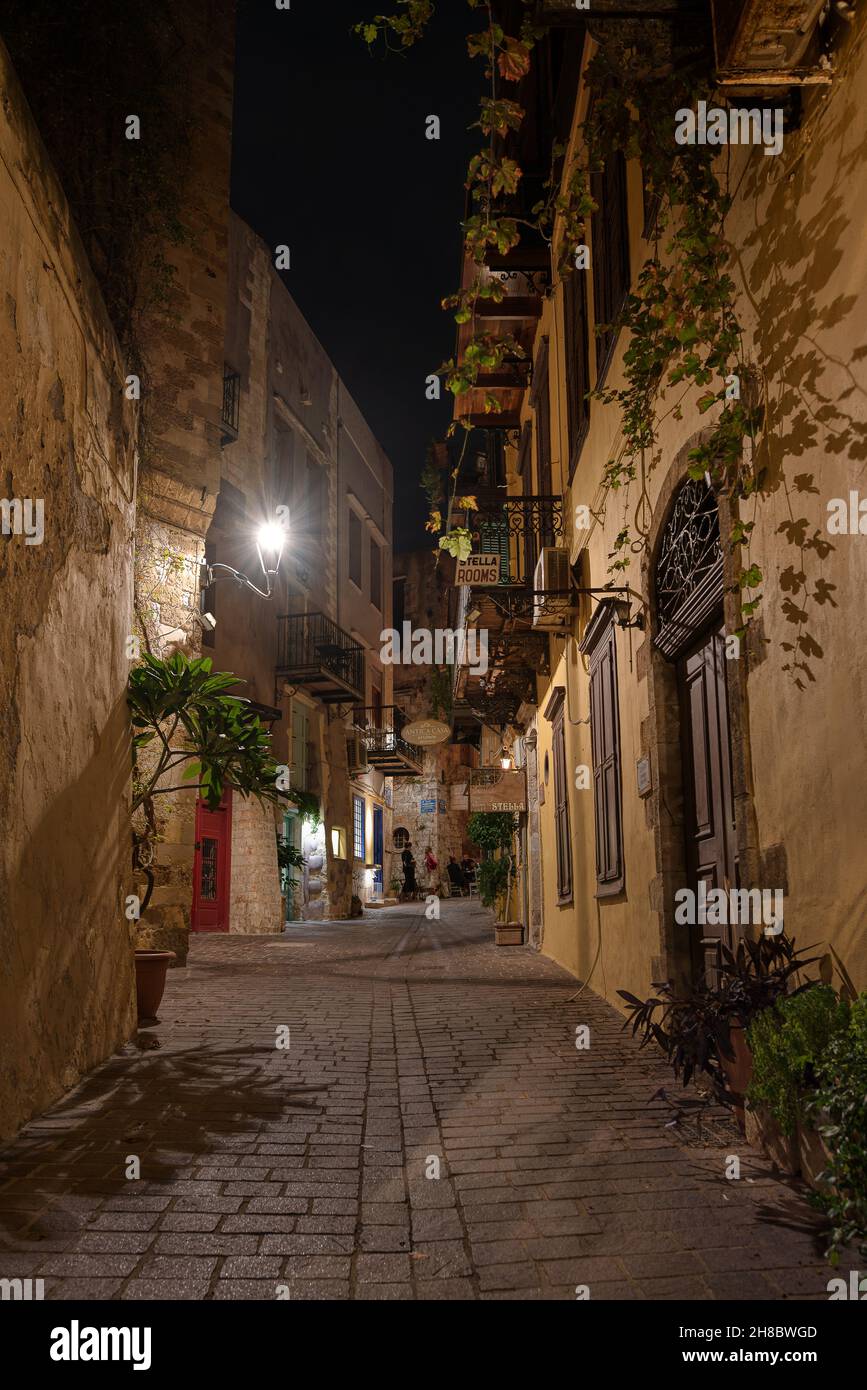 the romantic narrow alley Angelou in the old town of Chania, lit by a lantern, Chania, Crete, Greece, October 13, 2021 Stock Photo