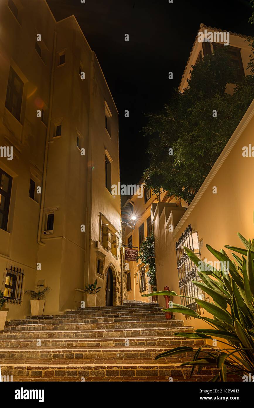 the illuminated stairs in Theofanous alley leading up to the hotel Porto del Colombo in the old town of Chania, Crete, Greece, October 13, 2021 Stock Photo