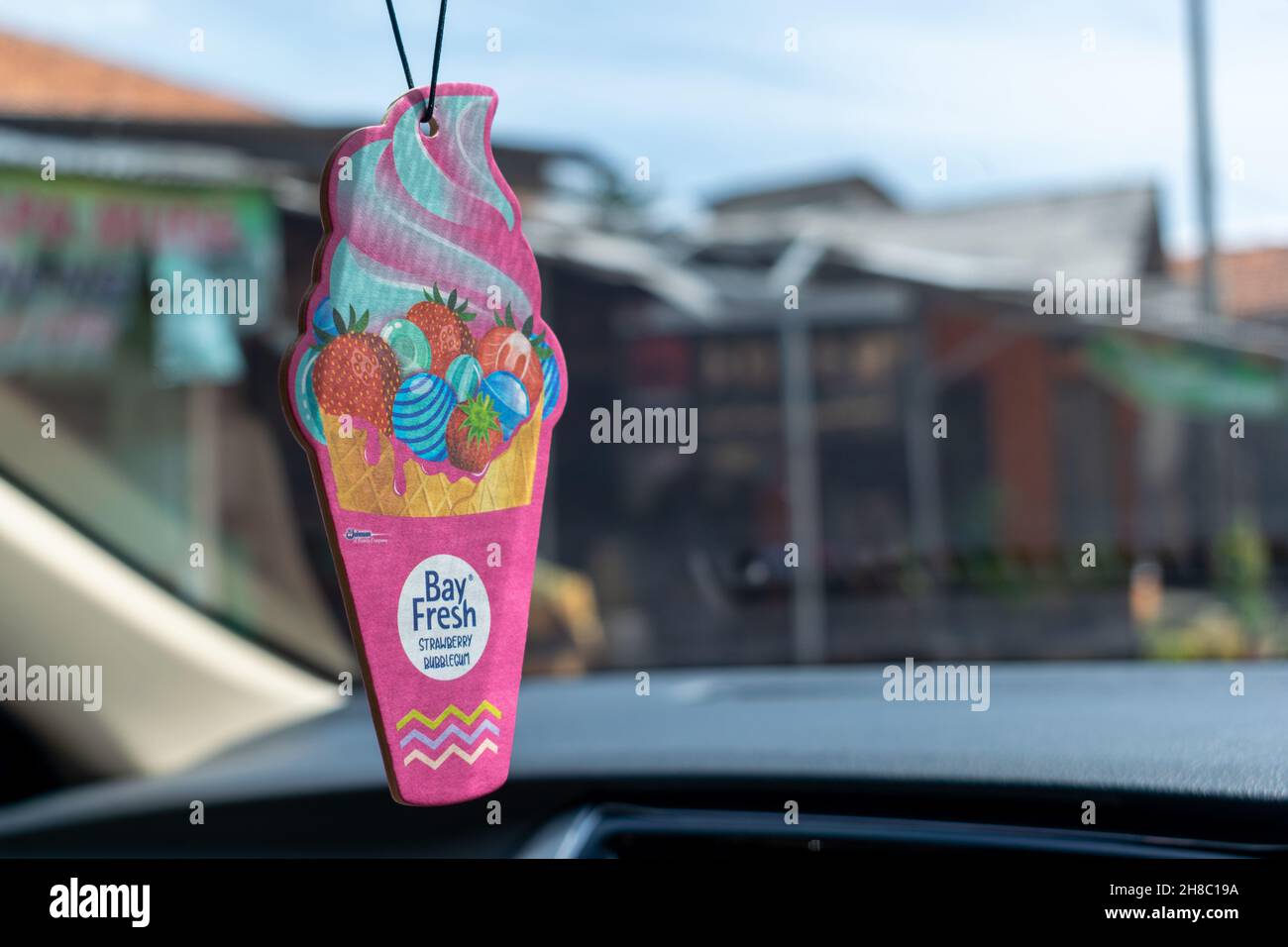 Car deodorizer hanging in the rearview mirror Stock Photo