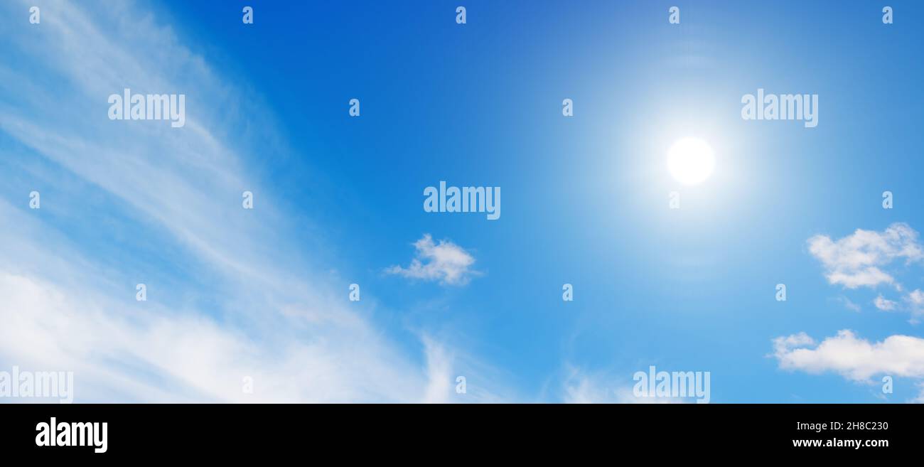 Bright sun in blue sky Stock Photo - Alamy