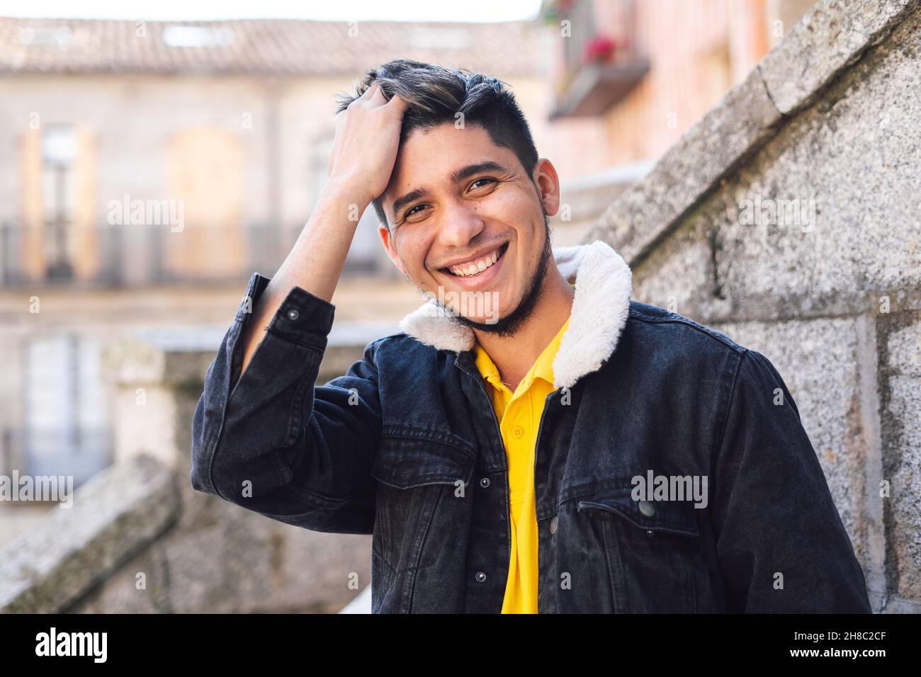 Closeup of the young man looking at the camera and smiling. Stock Photo