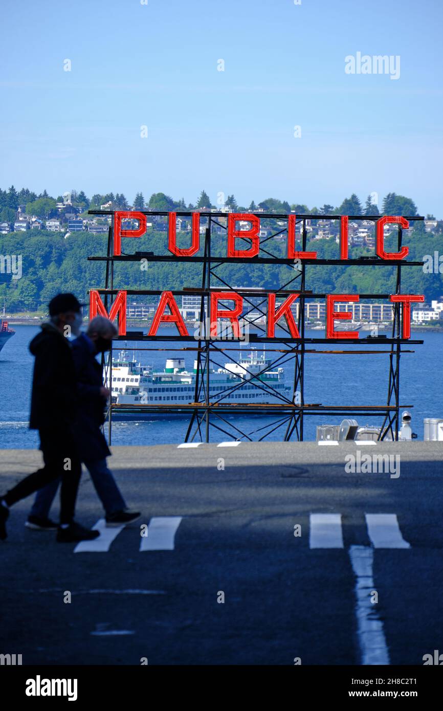 Silhouette of people in front of big red Public Market sign, Seattle Stock Photo