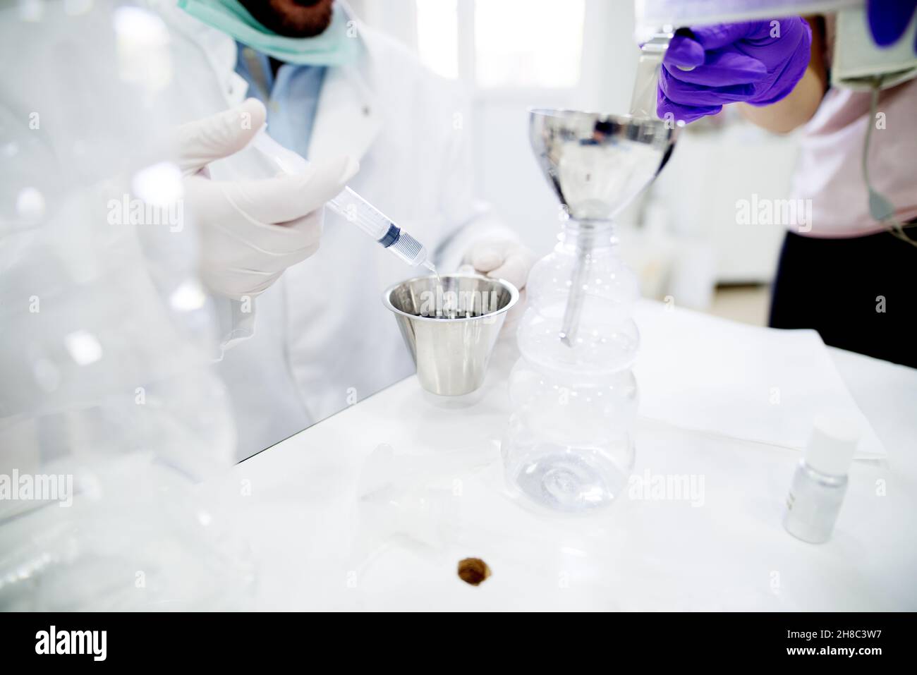 Lab technician doing chemical analysis. Testing chemical composition of the water. Stock Photo