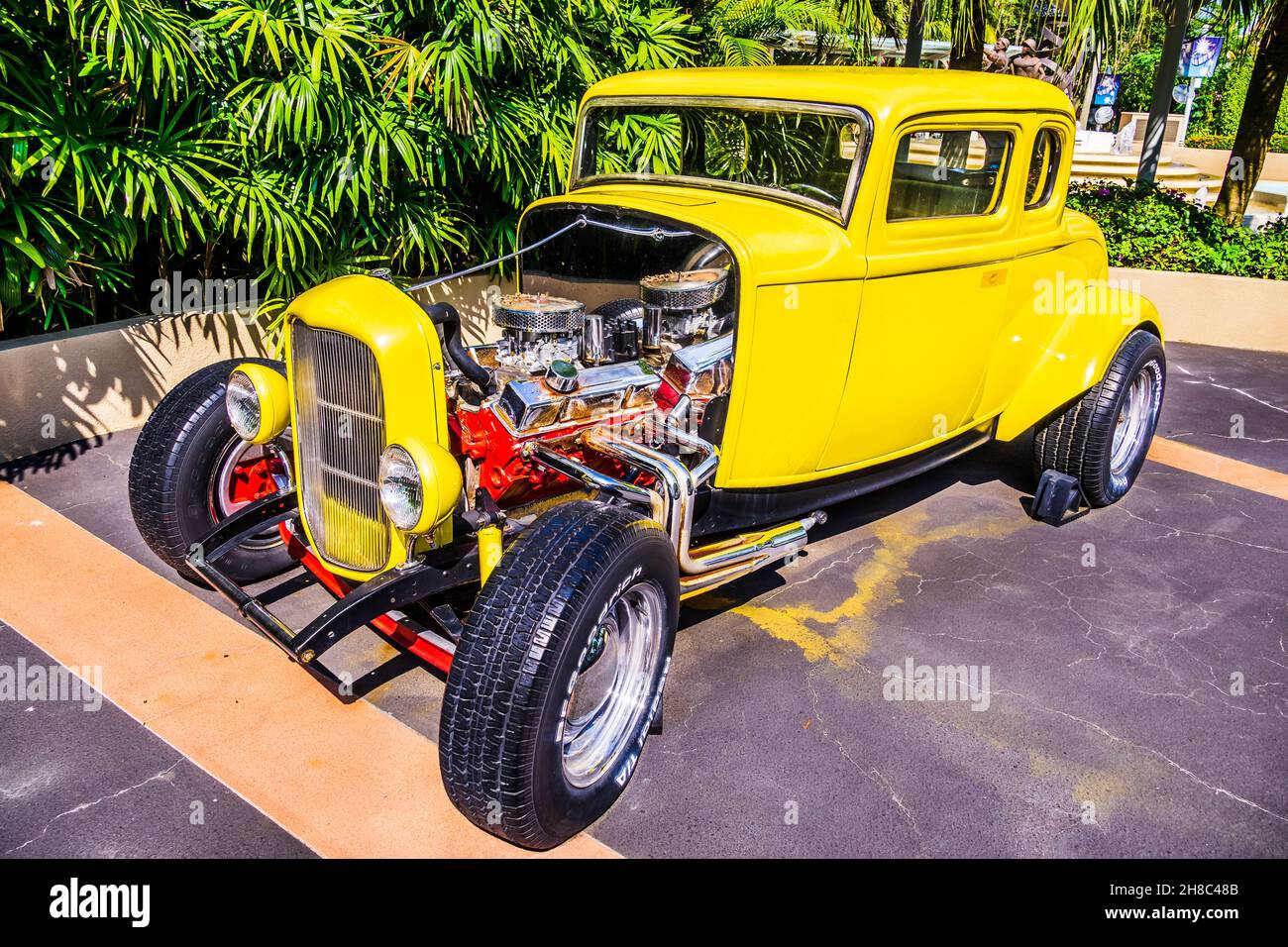 Beautiful front view of an antique yellow car in Universal Studios
