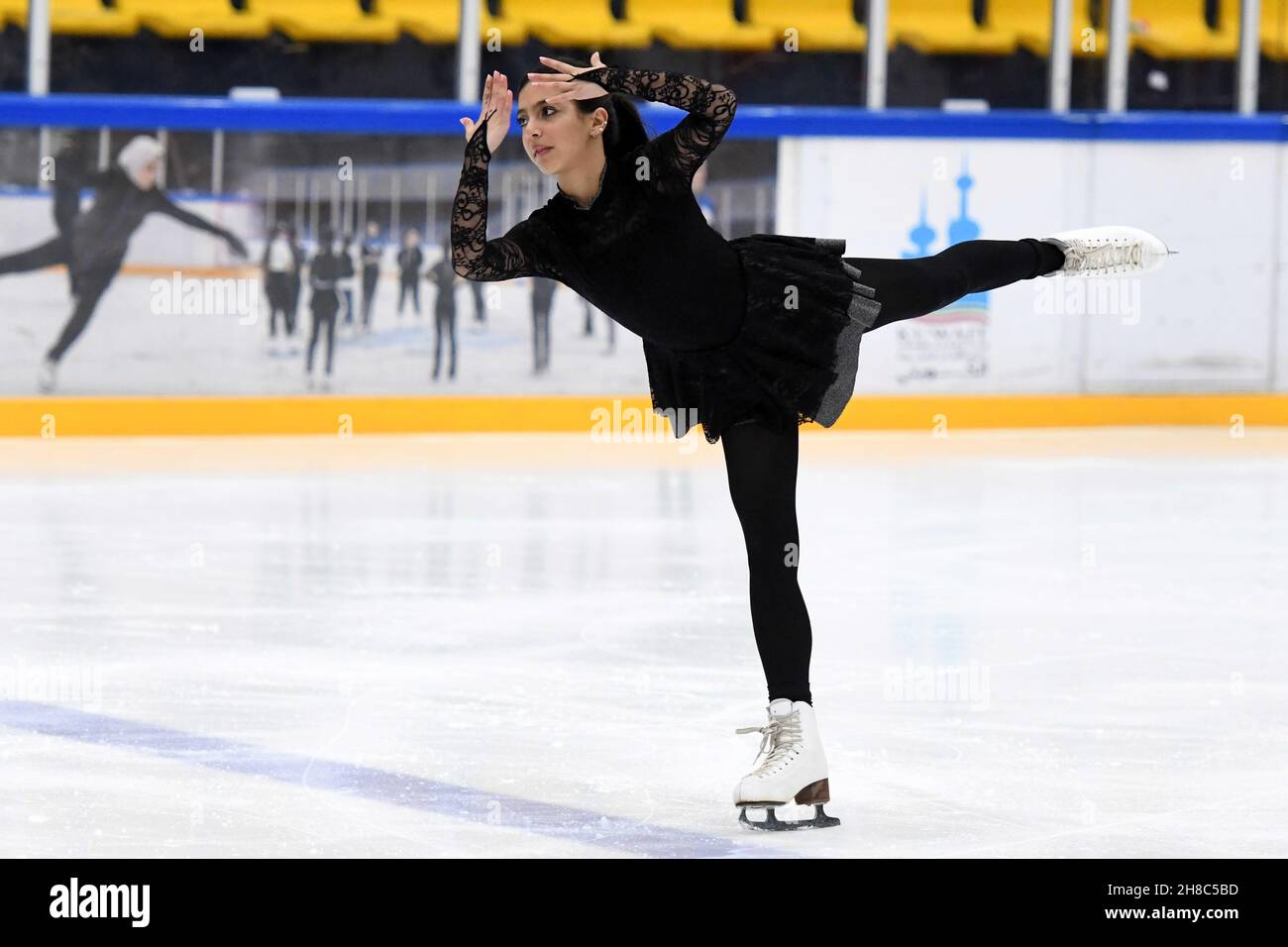 (211129) -- HAWALLI GOVERNORATE, Nov. 29, 2021 (Xinhua) -- Jory Al Mulla of Kuwait performs during the Kuwait National Championship of figure skating in Hawalli Governorate, Kuwait, on Nov. 28, 2021. (Photo by Ghazy Qaffaf/Xinhua) Stock Photo
