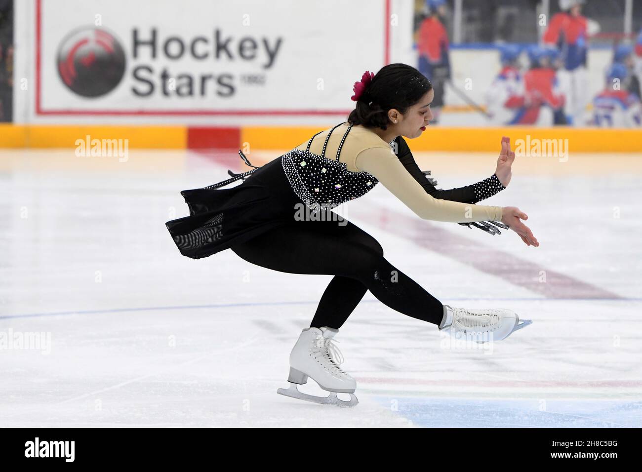 (211129) -- HAWALLI GOVERNORATE, Nov. 29, 2021 (Xinhua) -- Sara Allaho of Kuwait performs during the Kuwait National Championship of figure skating in Hawalli Governorate, Kuwait, on Nov. 28, 2021. (Photo by Ghazy Qaffaf/Xinhua) Stock Photo