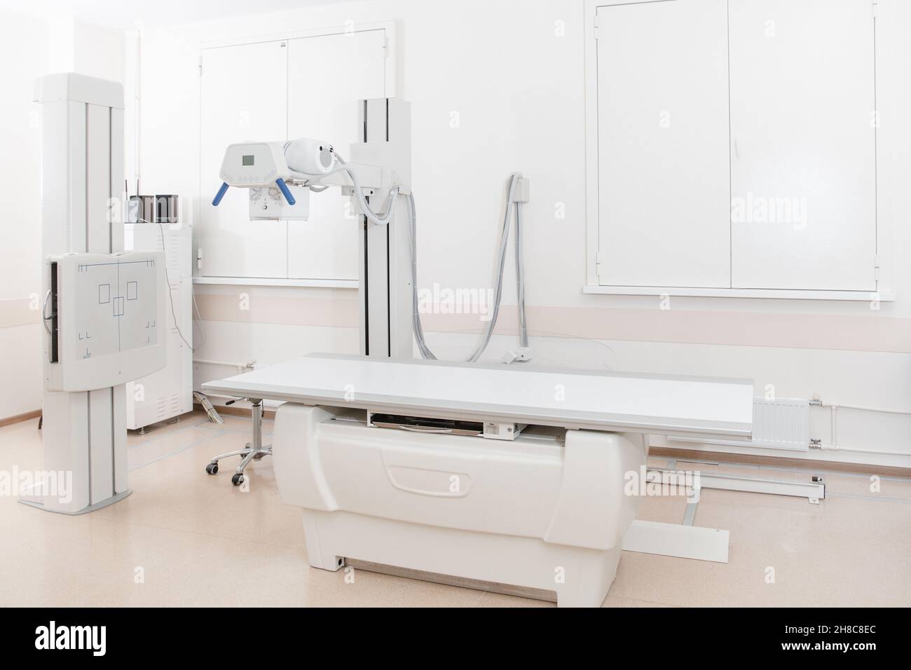 Xray department in modern hospital. Radiology room with scan machine