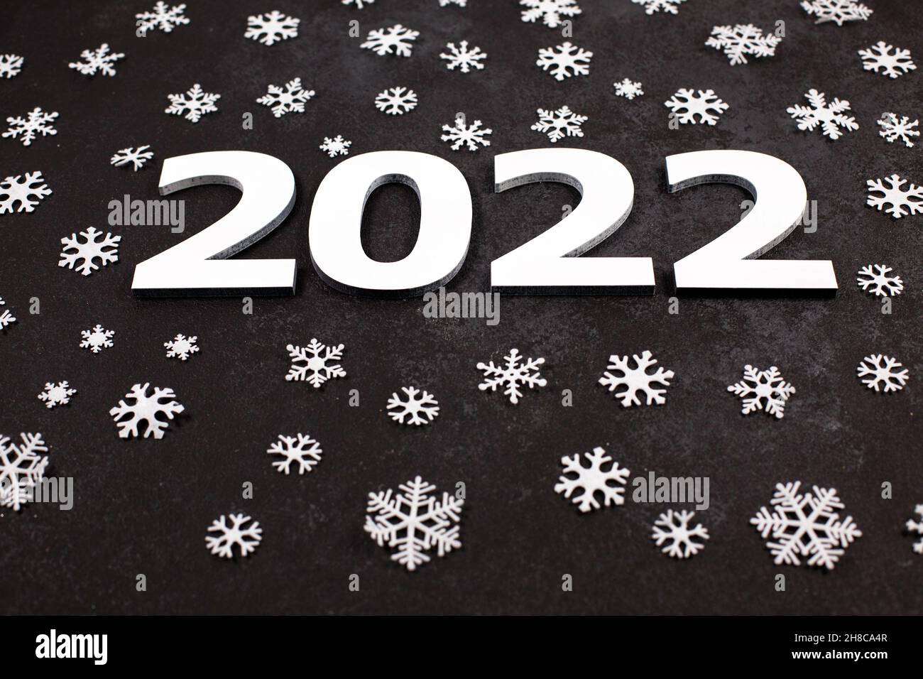 Merry Christmas 2022 Black And White Congratulatory Banner Merry Christmas And Happy New Year 2022 Wiht White  Different Sizes Snowflakes On Dark Background. Flat Lay, Top View. Winter  Season Stock Photo - Alamy