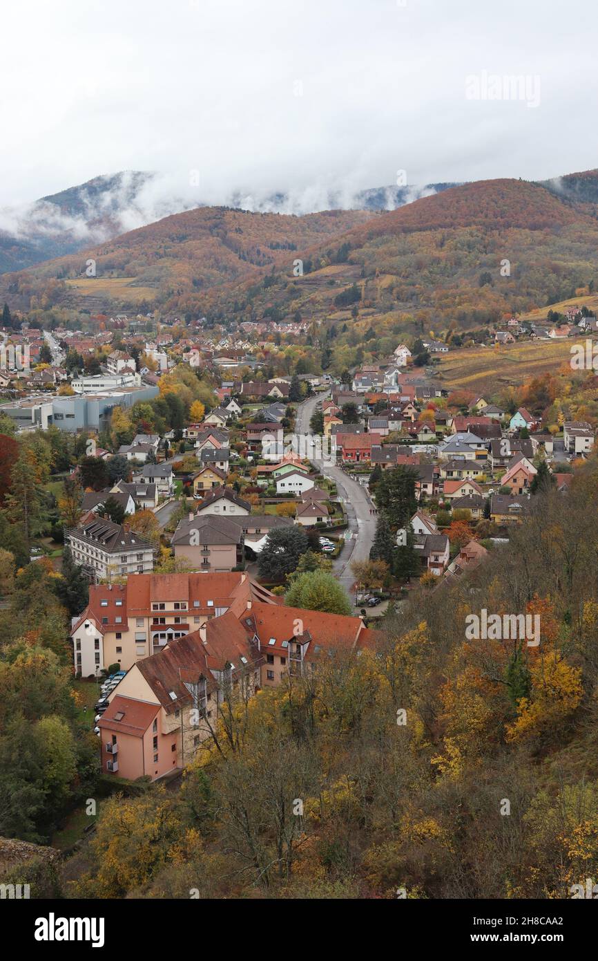 Autumnal aerial view of the historic town of Kaysersberg in the Alsace, France. View looking north west from the ramparts of Schlossberg Castle over t Stock Photo