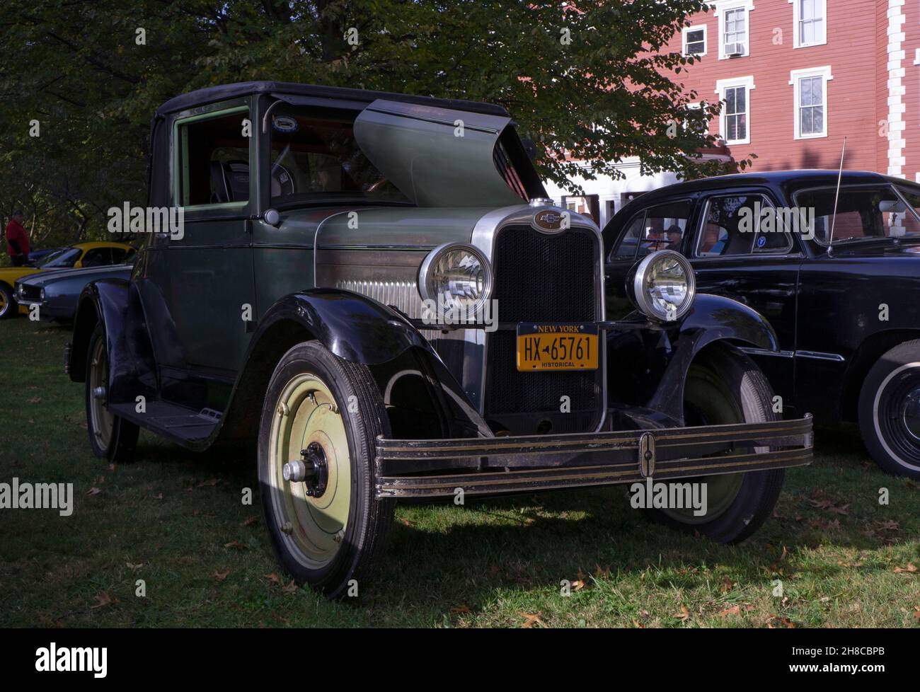 An antique 1928 Chevrolet 2 door sedan parked outside the Bayside Historical Society in Queens at a vintage car show. Stock Photo