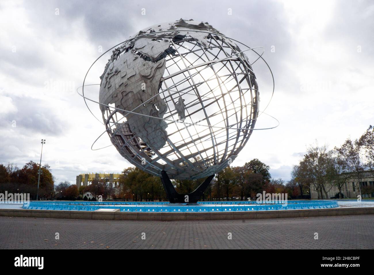 The Unisphere under dark dramatic late afternoon skies. In Flushing Meadows Corona Park in autumn 2021. Stock Photo