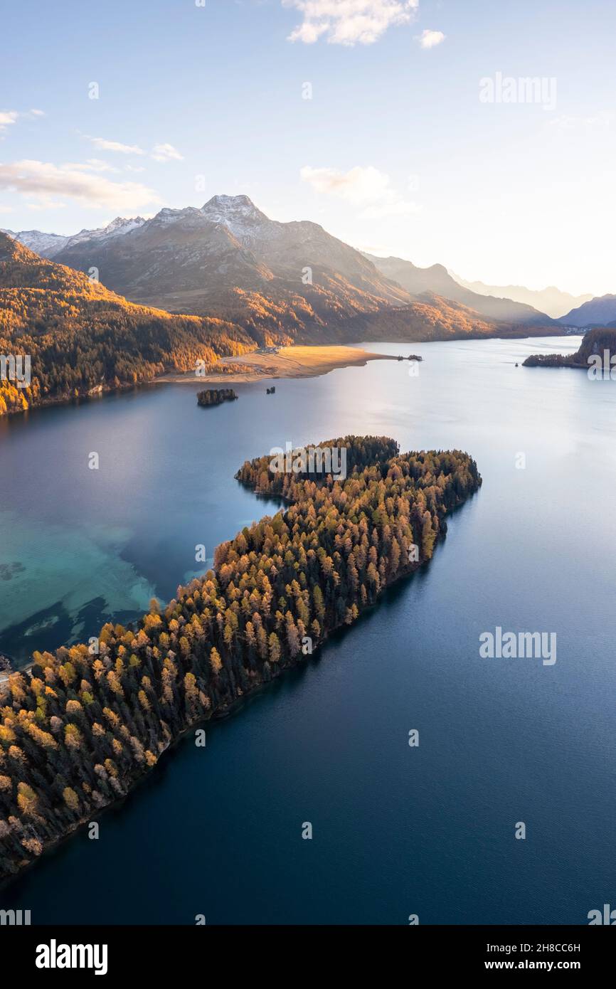 Aerial view of the Sils Lake and peninsula at sunset with Piz da la Margna in autumn. Sils im Engadin/Segl, Engadin, Switzerland, Canton of Grisons. Stock Photo