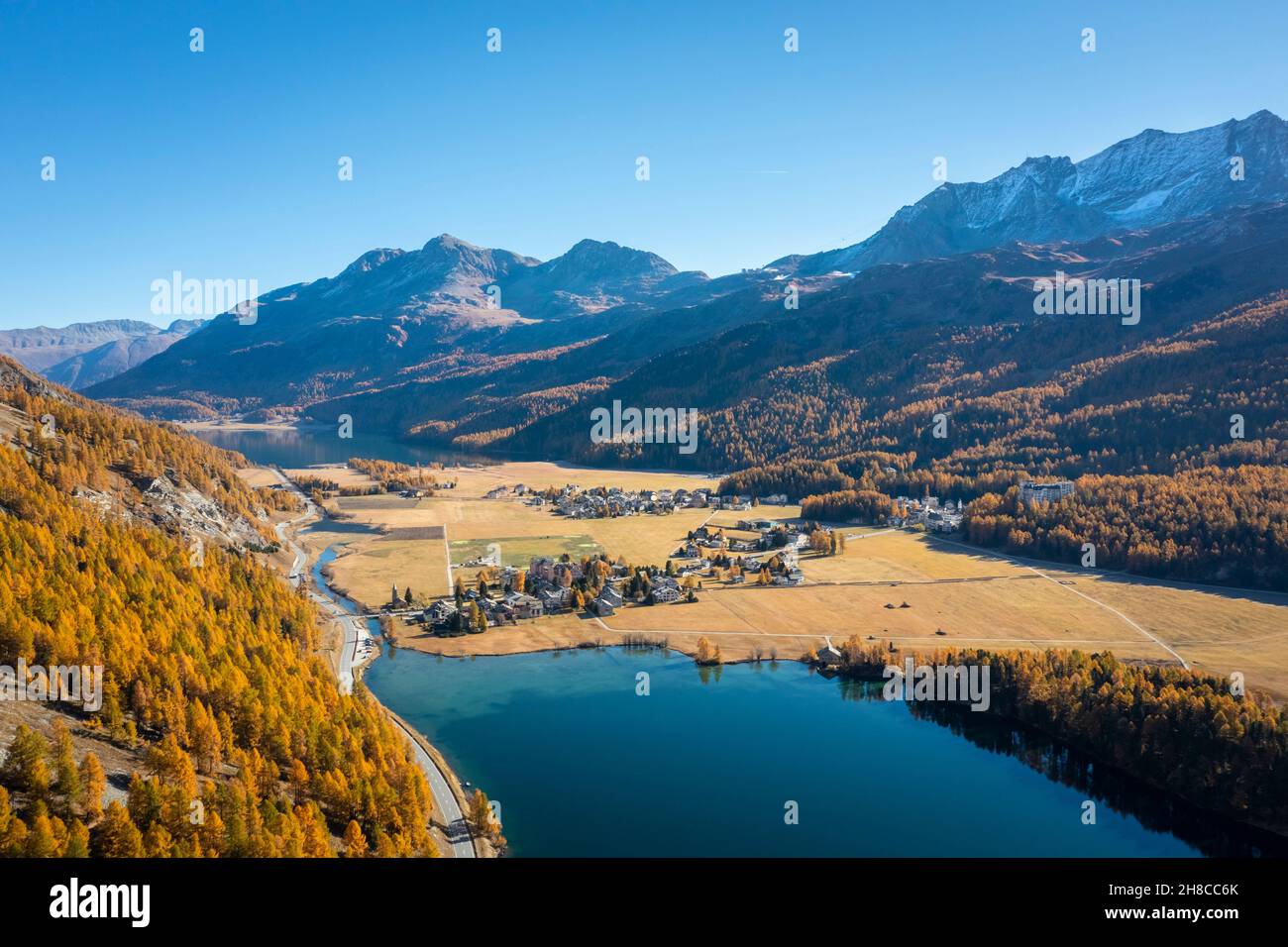 Aerial view of the Sils Lake at sunset with Piz da la Margna in autumn. Sils im Engadin/Segl, Engadin, Switzerland, Canton of Grisons. Stock Photo