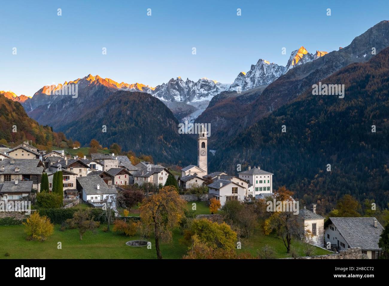 Aerial view of the small village of Soglio at sunset in autumn. Maloja district, Canton of Graubunden, Bregaglia valley, Switzerland, Europe. Stock Photo
