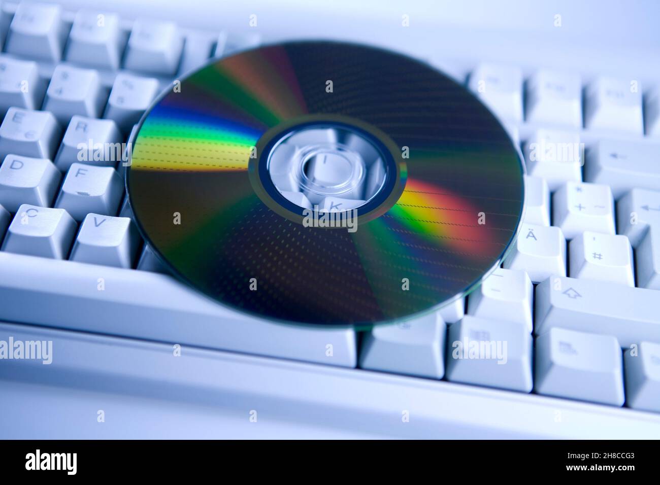 DVD on computer keyboard Stock Photo