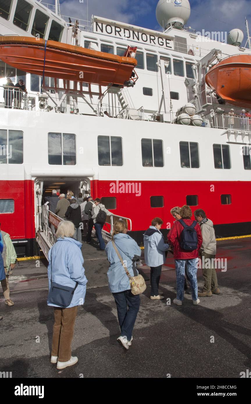 Passengers going aboard the Hurtigruten vessel Nordnorge docked in Vardo, Norway Stock Photo