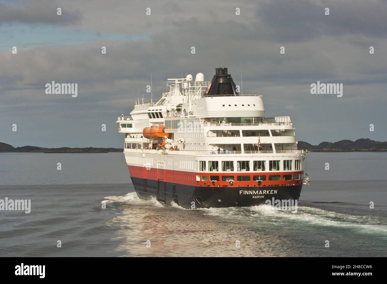 Norwegian Coastal Voyage Hurtigruten vessel Finnmarken near Ornes, Norway, Nordland Stock Photo