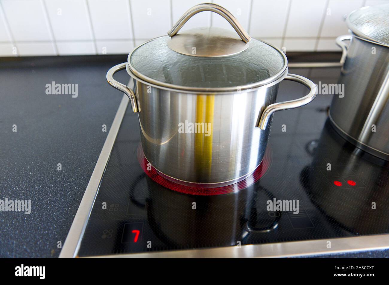cooking pot on zo large hotplate, waste of energy Stock Photo