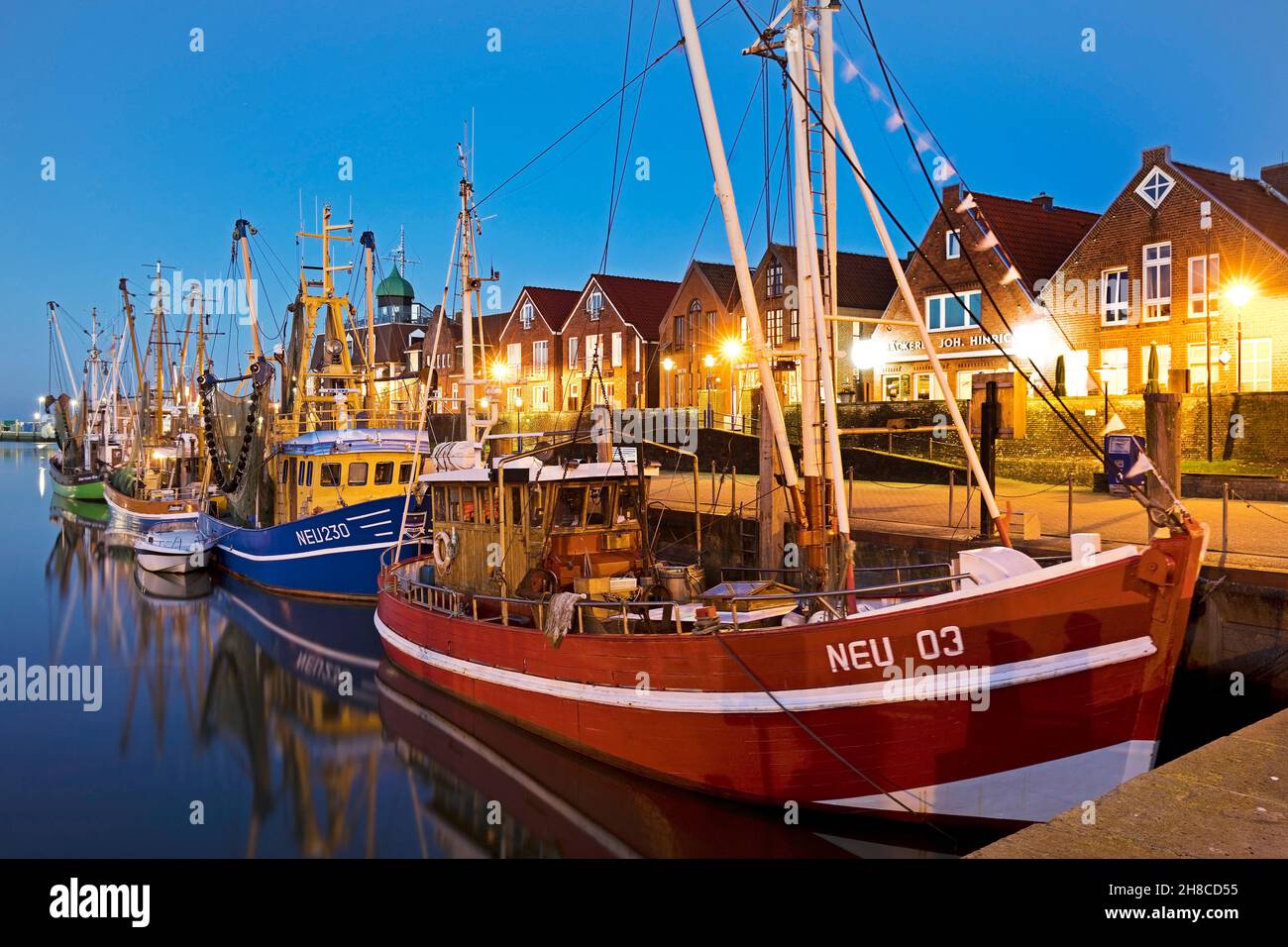 fishing harbour in the evening, Germany, Lower Saxony, Neuharlingersiel Stock Photo