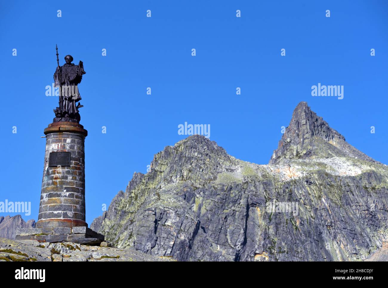 the statue of Saint Bernard at the pass of Grand Saint Bernard near the Suisse board, Italy, Aosta Valley, Saint Remy en Bosses Stock Photo