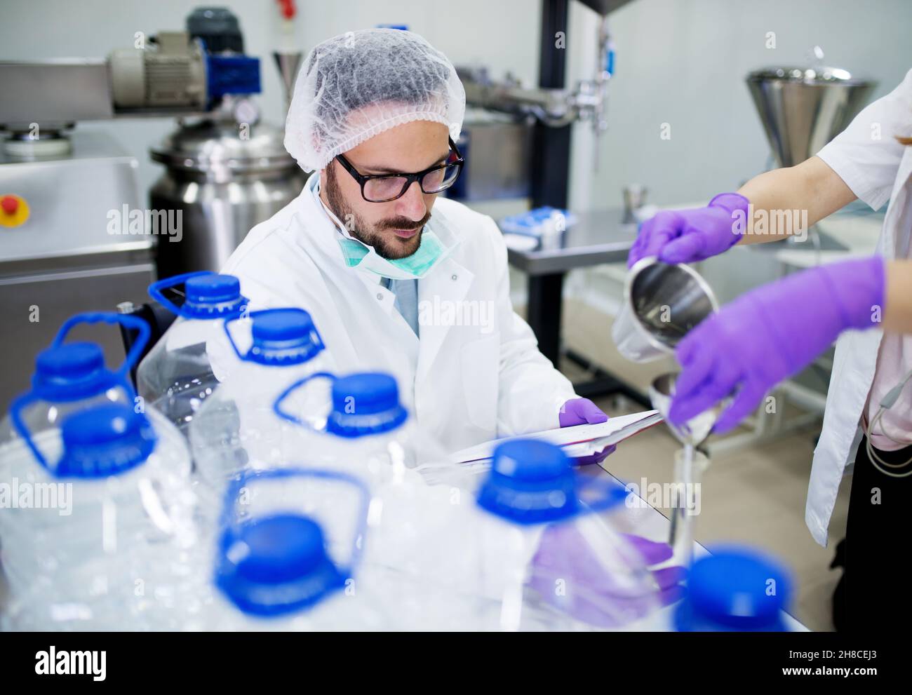 Lab technician doing chemical analysis. Testing chemical composition of the water. Stock Photo