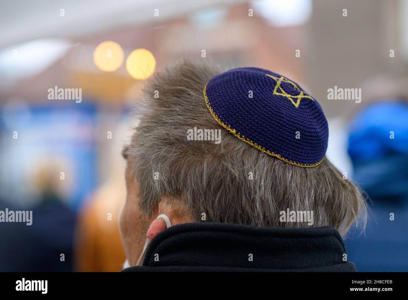 Magdeburg, Germany. 29th Nov, 2021. A Star of David can be seen on a man's kippah in front of the community centre of the Magdeburg synagogue. The Hanukkah candlestick was lit there at noon. The Hanukkah festival of lights is an eight-day Jewish festival celebrated annually to commemorate the rededication of the Second Temple in Jerusalem in 164 B.C., or the year 3597 of the Jewish calendar. Credit: Klaus-Dietmar Gabbert/dpa-Zentralbild/dpa/Alamy Live News Stock Photo