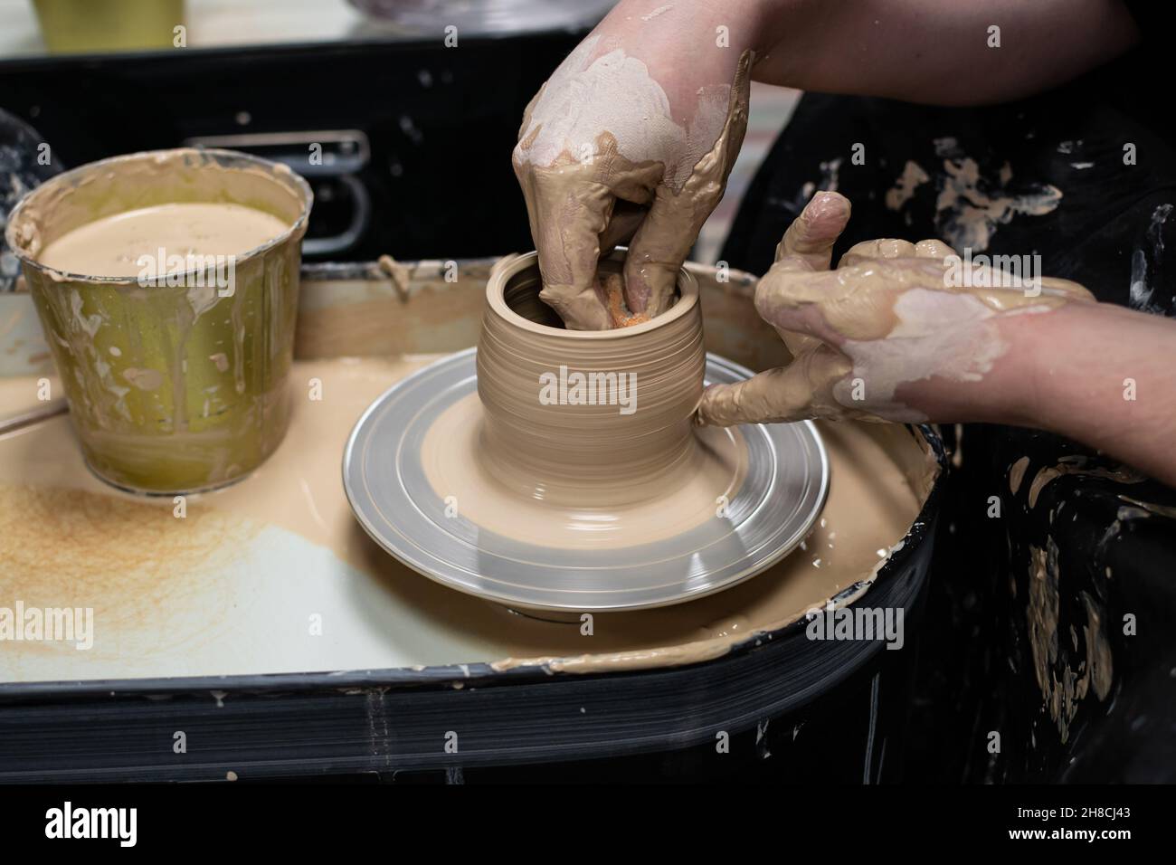 Clay modeling training on a potters wheel, clay master class. Art