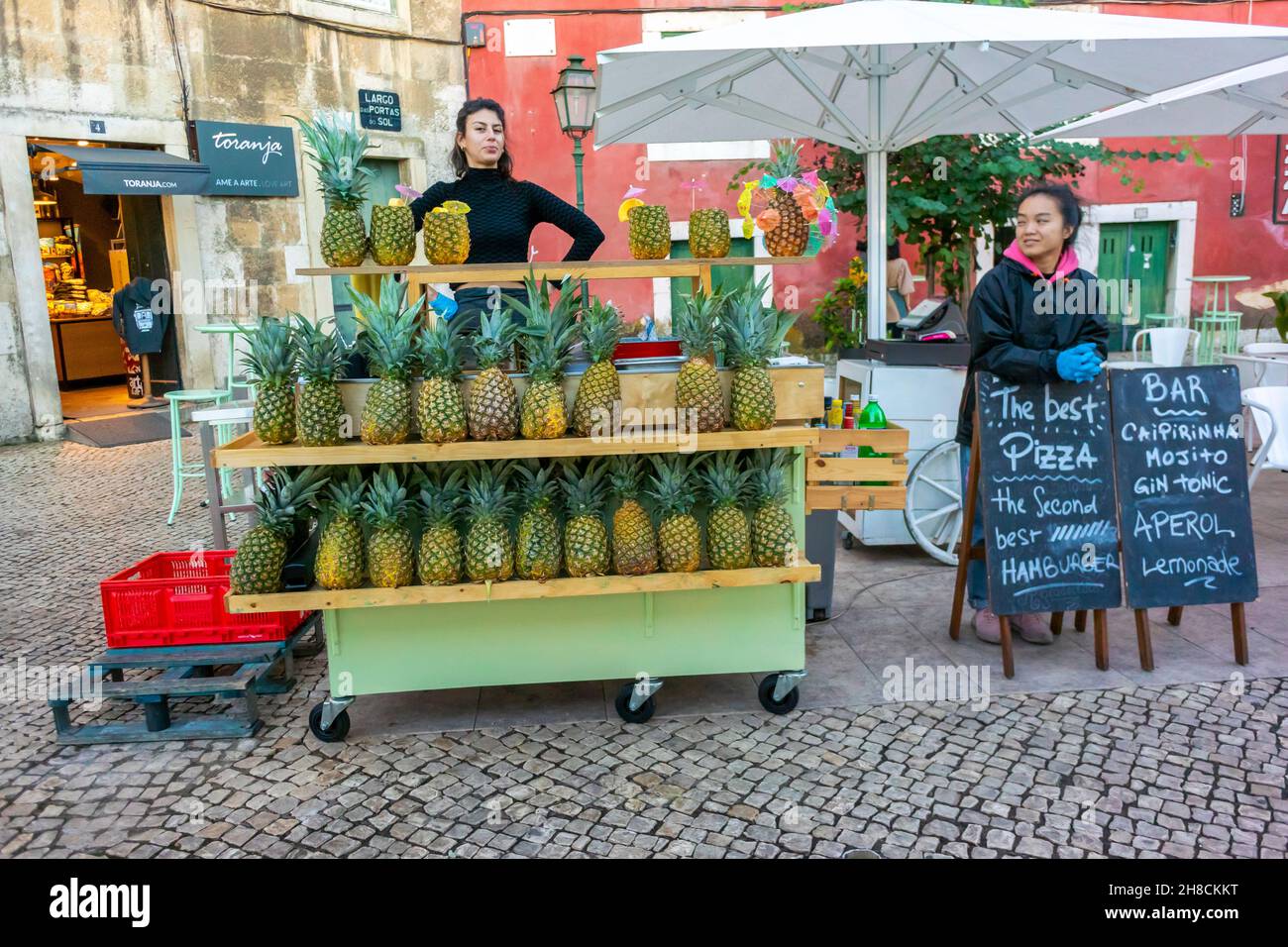 Lisbon, Portugal, Street Vendor, Women, on Street, Pineapple Juice, Drinks in Alcantara