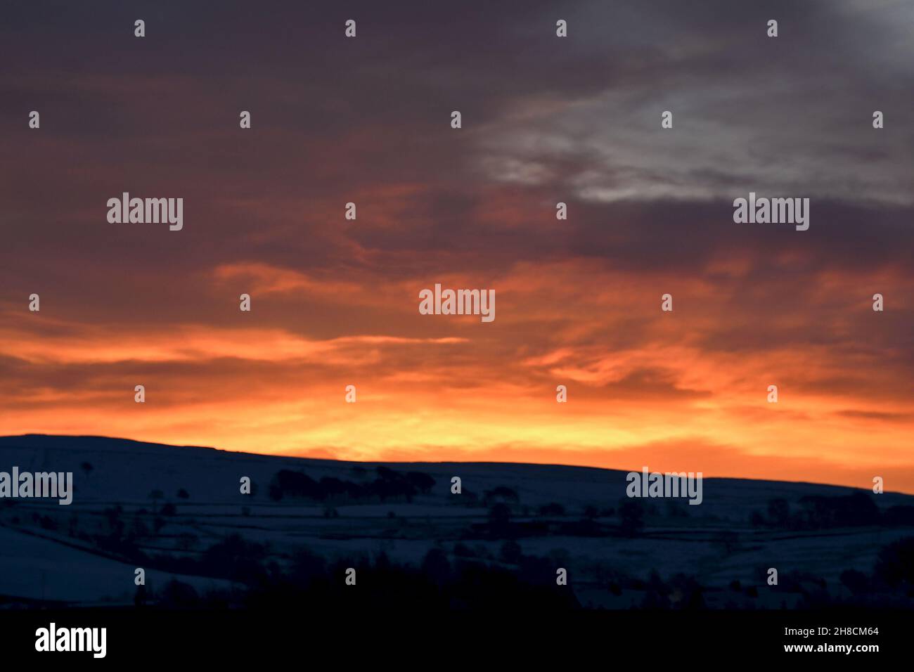 Red sky in morning in New Mills, Peak District, Derbyshire Stock Photo
