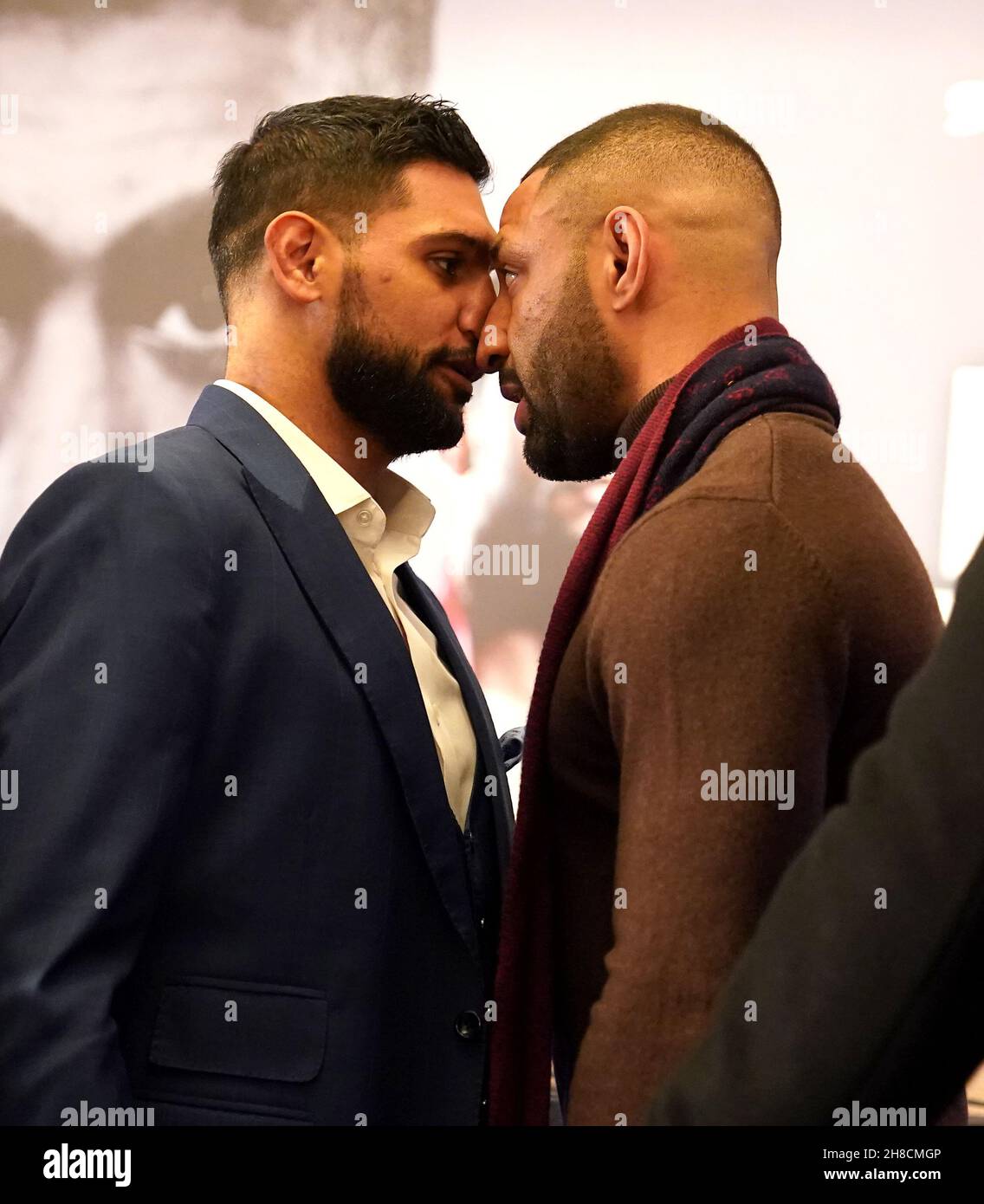 Amir Khan (left) and Kell Brook confront each other during a press conference at the London Hilton, London. Domestic rivals Amir Khan and Kell Brook will finally settle their long-running grudge on February 19. Picture date: Monday November 29, 2021. Stock Photo