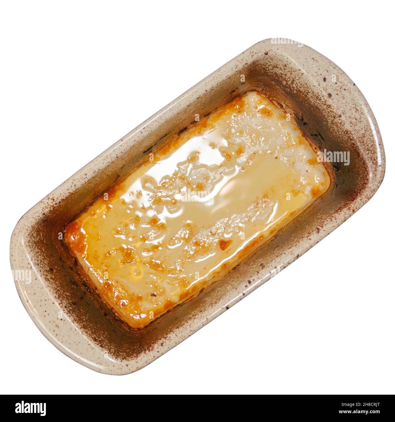 Baking tray with burnt on grease and oil isolated on white background flat lay view Stock Photo